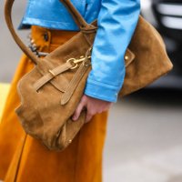 Fay wears a dark brown Miu Miu suede bag, outside Miu Miu, during the Paris Fashion week Women's Fall/Winter 2025-2026 on March 11, 2025 in Paris,...