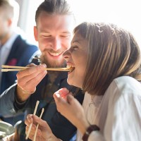 feeding with sushi - junk food stock pictures, royalty-free photos & images