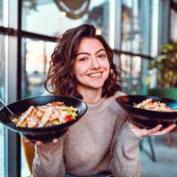 female and her salad choice - junk food stock pictures, royalty-free photos & images