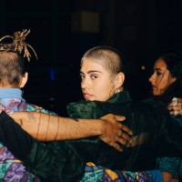 female and male friends with arms around during night - fashion stock pictures, royalty-free photos & images