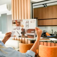 female architect looking at the picture of interior design - home decoration stock pictures, royalty-free photos & images