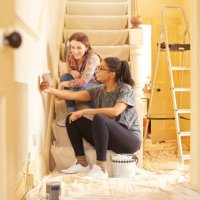 female couple choosing swatch colours - home decoration stock pictures, royalty-free photos & images