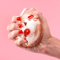 female dieter crushing belgian bun - junk food stock pictures, royalty-free photos & images