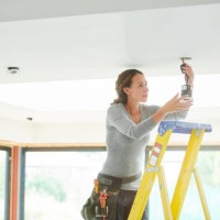 female electrician installing downlights - home decoration stock pictures, royalty-free photos & images