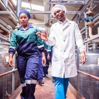 female factory worker walking with her supervisor at a factory - food stock pictures, royalty-free photos & images