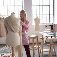 female fashion designer putting her creativity to work - fashion stock pictures, royalty-free photos & images