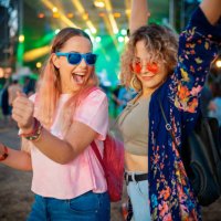 female friends dancing and raising arms to good music on festival - concert stock pictures, royalty-free photos & images