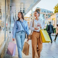 female friends looking at store window - fashion stock pictures, royalty-free photos & images