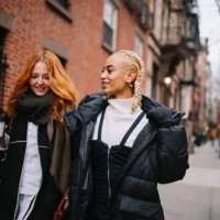 female friends talking on the street in west village, manhattan, ny - fashion stock pictures, royalty-free photos & images