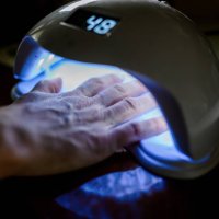 female hand in the lamp for manicure - nails art stock pictures, royalty-free photos & images
