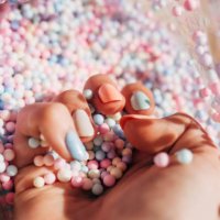 female hands with colorful polish nails. woman well-groomed hands with multicolor nails on salon table. manicure nail painting. - nails art photos et images de collection