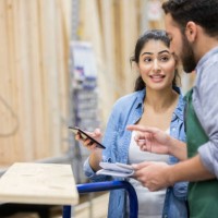 female home improvement store customer talks with employee - home decoration stock pictures, royalty-free photos & images