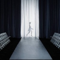 female model (15-17) walking backstage at fashion show, side view - fashion stock pictures, royalty-free photos & images