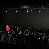 female model walking down catwalk at fashion show - fashion week stock pictures, royalty-free photos & images