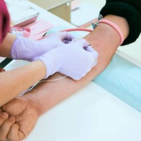 female nurse is taking blood of a senior patient at hospital. - junk food stock pictures, royalty-free photos & images