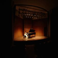 female pianist playing grand piano at concert hall - concert stock pictures, royalty-free photos & images