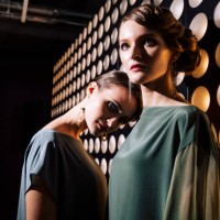female portrait of two fashion woman at the backstage of fashion week show. lifestyle photography, behind the scenes of new clothing collection. girls wear by fashion designer. wall with lights - fashion stock pictures, royal