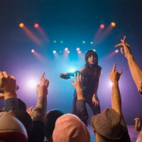 female rock star on stage interacting with audience - concert stock pictures, royalty-free photos & images