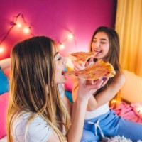 female slumber party - junk food stock pictures, royalty-free photos & images