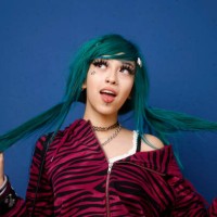 female with green hair pulling on her ponytails - fashion stock pictures, royalty-free photos & images