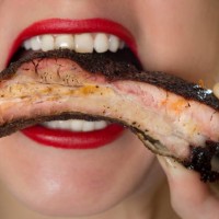 female with lipstick eating bbq ribs - junk food stock pictures, royalty-free photos & images