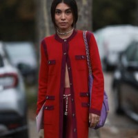 Fer Millán Delaroière is seen outside Chanel show wearing Chanel pearl necklace, red and lilac Chanel cardigan, lilac Chanel 22 tote bag, red high...