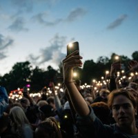 Festival goers light up the torchlights of their phones while Offset performs during Ruisrock 2024 on July 5, 2024 in Turku, Finland.