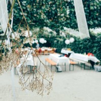 festive decorated table outdoors and white flowers in focus - garden decoration stock pictures, royalty-free photos & images