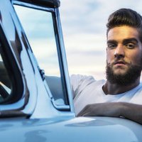 fifties pompadour greaser hipster guy driving classic convertible car - hairstyle stock pictures, royalty-free photos & images