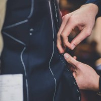 fingers pinning a tailored suit - fashion stock pictures, royalty-free photos & images