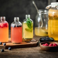 flavored kombucha tea bottles in the kitchen - food stock pictures, royalty-free photos & images