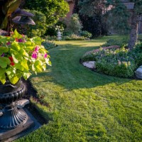 flower pot and courtyard at dusk in woodbridge town, vaughan, canada - garden decoration stock pictures, royalty-free photos & images