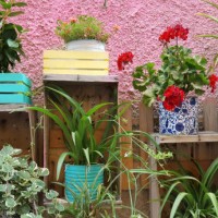 flower pots arrangement in a street of orbetello, italy - garden decoration stock pictures, royalty-free photos & images