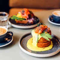 fluffy pancakes with salmon and avocado served for breakfast at the restaurant - food stock pictures, royalty-free photos & images