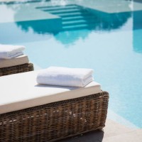 folded towels on lounge chairs beside pool - home decoration stock pictures, royalty-free photos & images