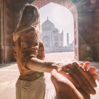 follow me to the taj mahal, india. female tourist leading boyfriend to there magnificent famous mausoleum in agra. people travel concept - travel stock pictures, royalty-free photos & images