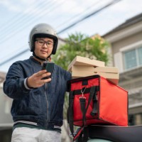 food delivery man getting ready for work - junk food stock pictures, royalty-free photos & images