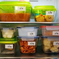 food leftovers packaged in boxes inside a home fridge - food stock pictures, royalty-free photos & images