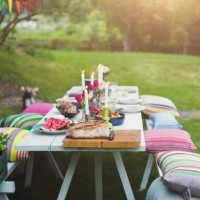 food served on decorated picnic table at back yard during garden party - garden decoration stock pictures, royalty-free photos & images