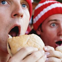 football supporters at match, holding hambugers, gasping - food stock pictures, royalty-free photos & images
