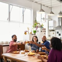 four friends celebrating with beer and curry - junk food stock pictures, royalty-free photos & images