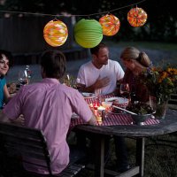 four people at a dinner party - garden decoration stock pictures, royalty-free photos & images