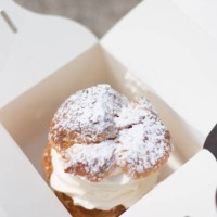 france: big vanilla cream puff in white take-away box - junk food stock pictures, royalty-free photos & images