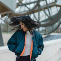france, paris, smiling young woman tossing her hair - fashion stock pictures, royalty-free photos & images