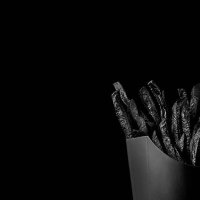 french fries on black backdrop - junk food stock pictures, royalty-free photos & images
