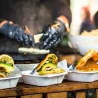 fresh avocado wraps for sale at vegetarian stall at food market - junk food stock pictures, royalty-free photos & images