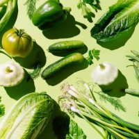 fresh green organic vegetables and fruits on green background. healthy food, diet and detox concept. flat lay, top view - food stock pictures, royalty-free photos & images