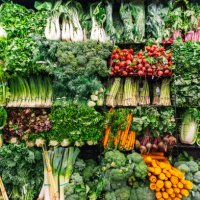 fresh greens and vegetables on a display in a supermarket - food stock pictures, royalty-free photos & images