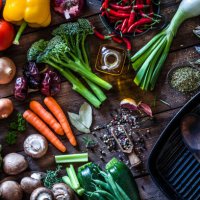 fresh vegetables ready for cooking shot on rustic wooden table - food stock pictures, royalty-free photos & images
