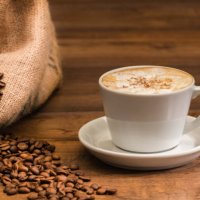 freshly brewed cup of coffee with beans - coffee stock pictures, royalty-free photos & images